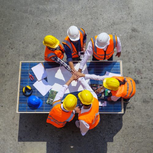 Top,View,Of,Architectural,Engineers,Putting,Their,Hands,Together,On